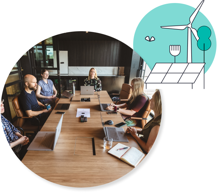 People sitting around a wooden table with a green circle and windmill wind turbine in the top right corner