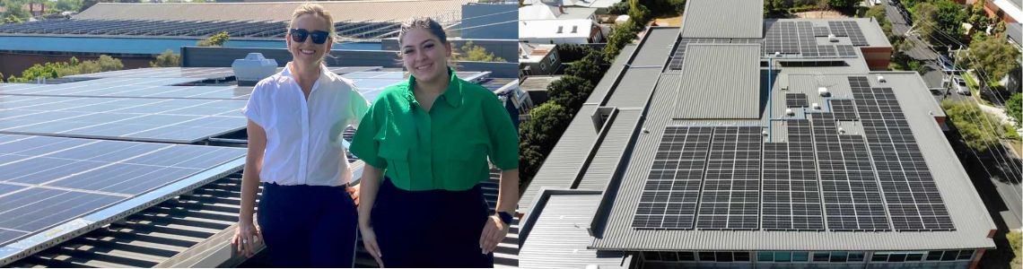 Annabel Jarvis and Anna from Caufield Grammar standing next to roof with solar panels